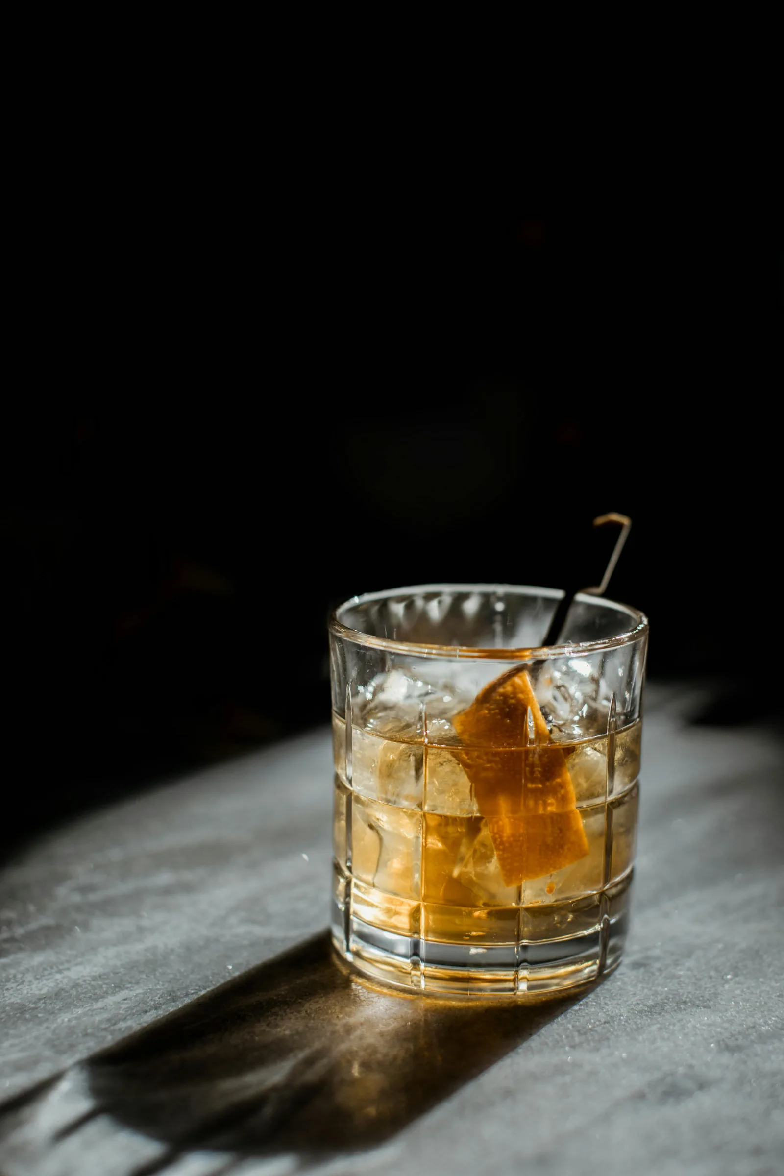 Real whiskey glass with ice cubes